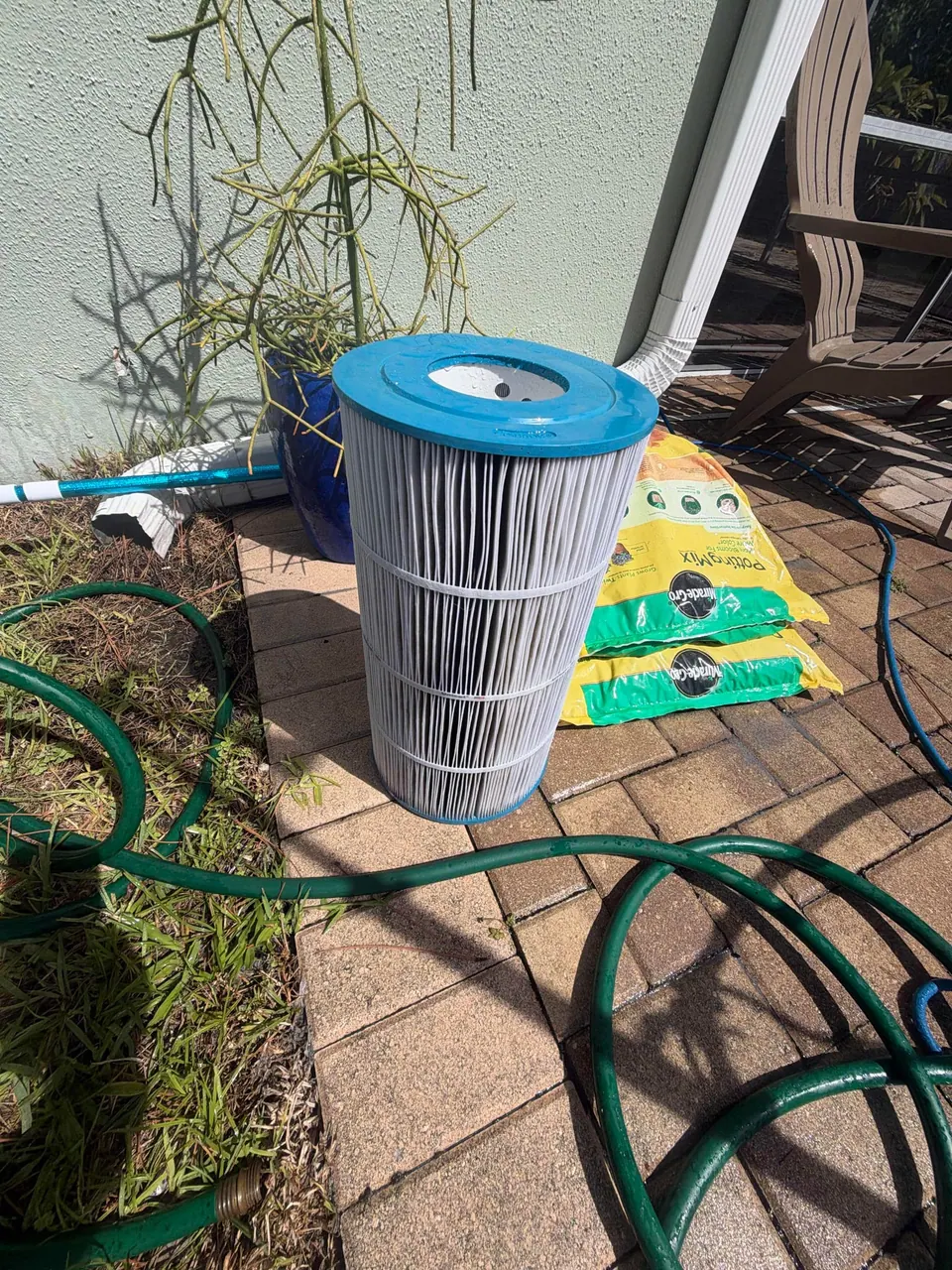 The same pool cartridge filter, clean and white after a deep cleaning